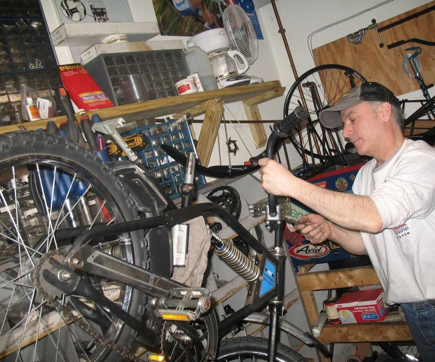 Picture of a bike mechanic working on a bike