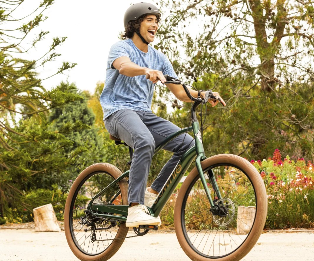 Happy Human Riding An Electric Cruiser Bike