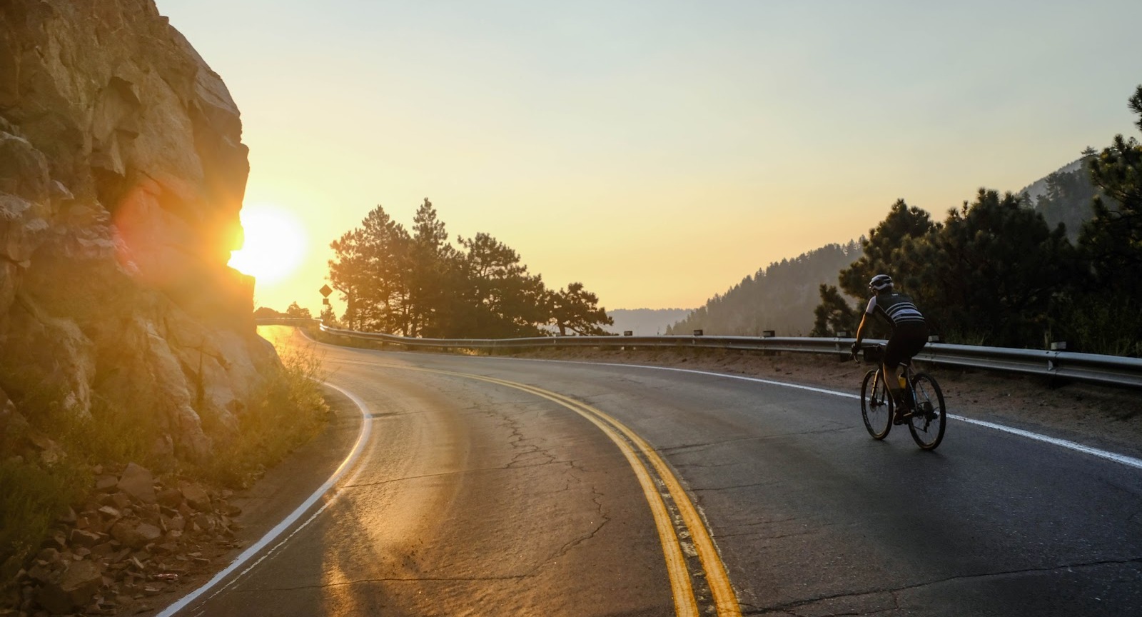 road cyclist in front of a sunset