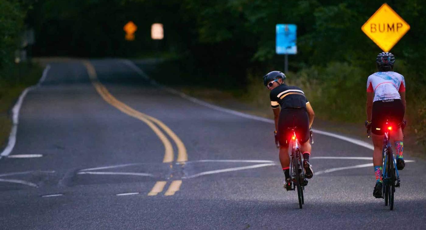 Woman riding bike with head light