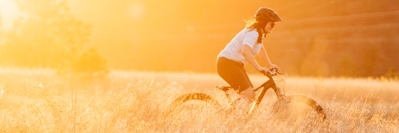 Image of a woman riding a mountain bike