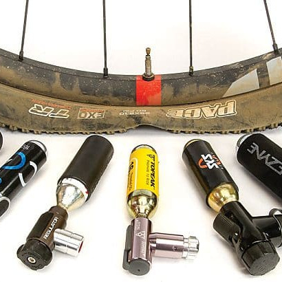 A flat tire with CO2 cartridges around it