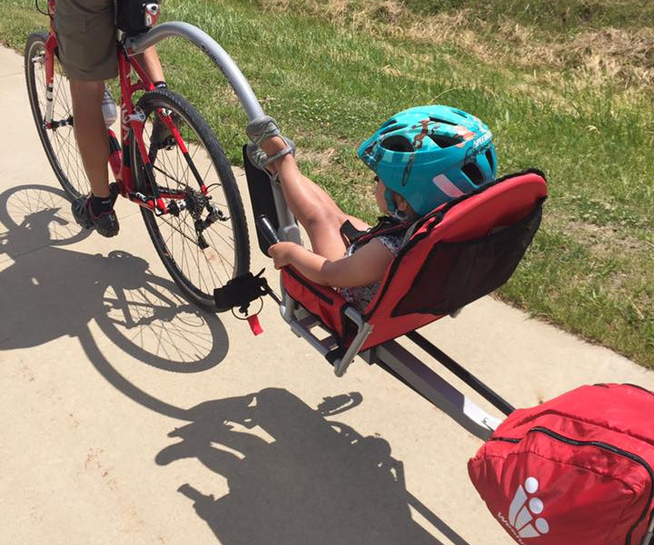 A child riding on a weehoo