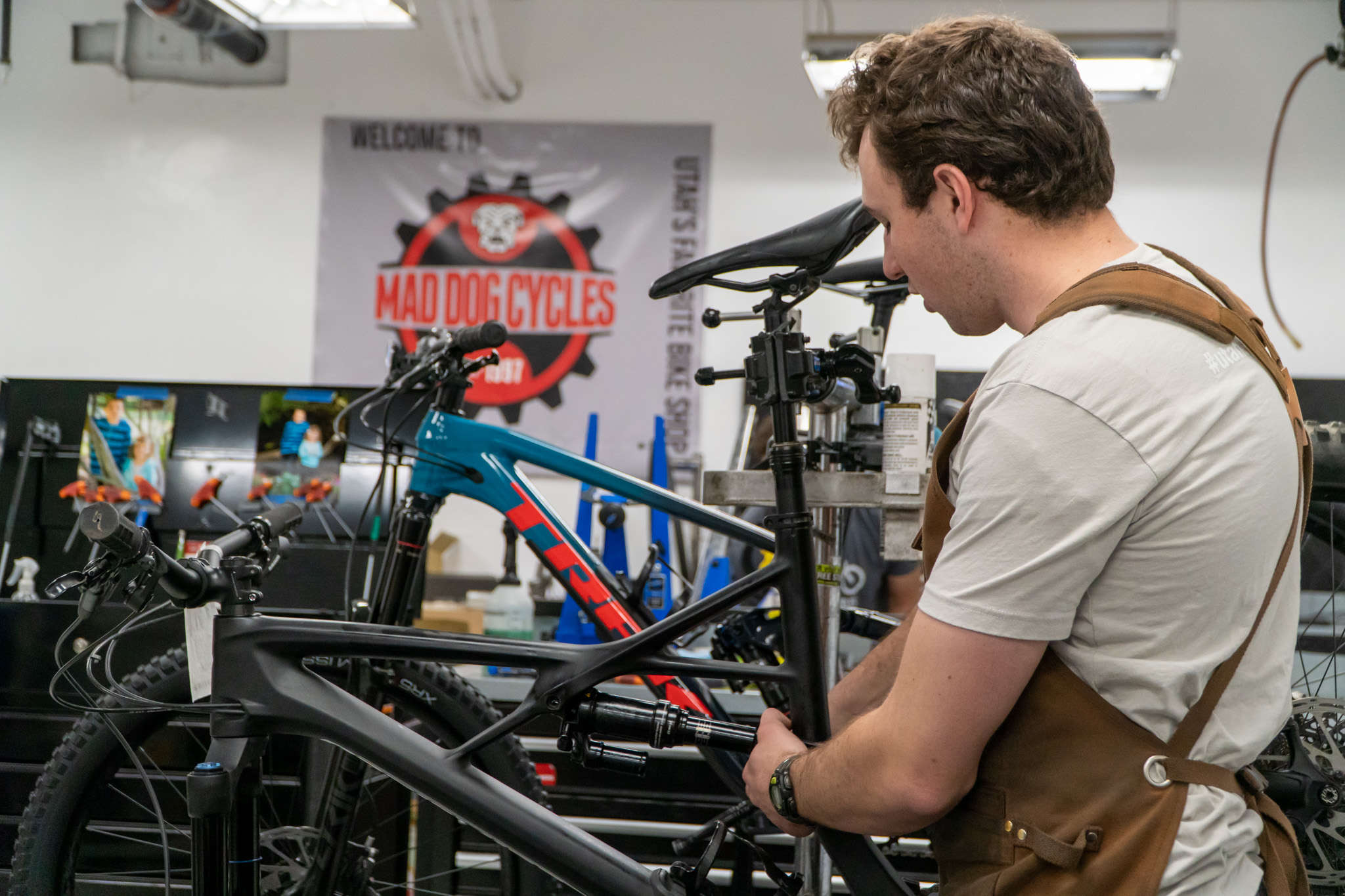 Image of Mad Dog Cycles bike technician working on a bike