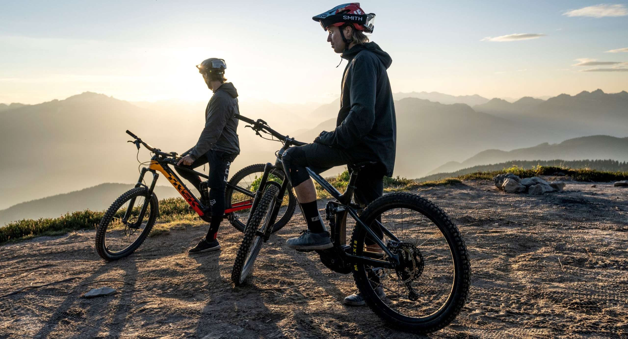 Image of two people on mountain bikes on a mountain