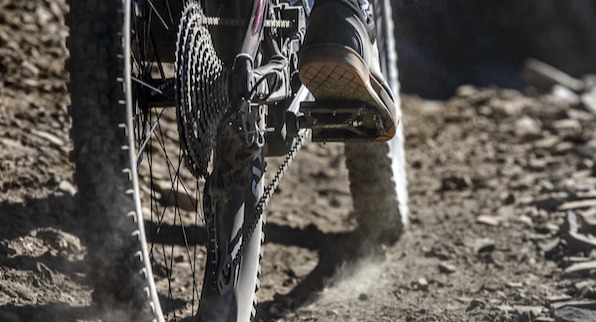 People riding mountain bikes with mountain shoes