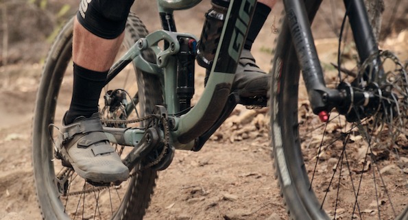 People riding mountain bikes with mountain shoes