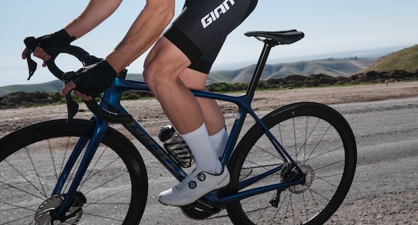 Woman riding road bike with road shoes