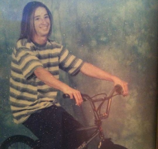 Rob at about age 14 sitting on his BMX bike.