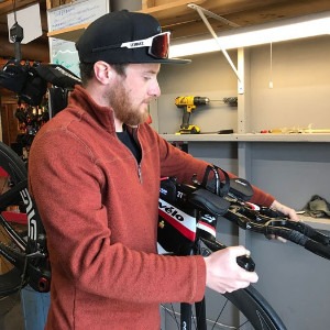 Dustin checking out some aerobars on a triathlon bike