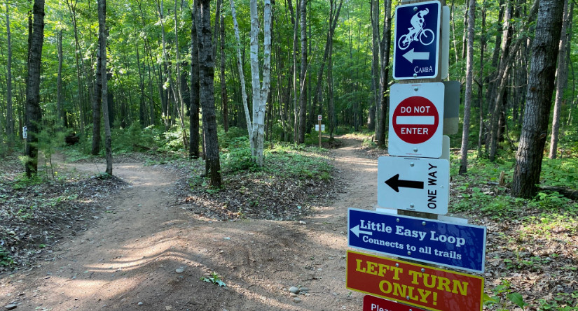 trailhead with directional signs