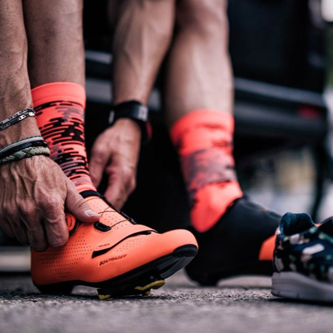 close up of cycling shoes being put on