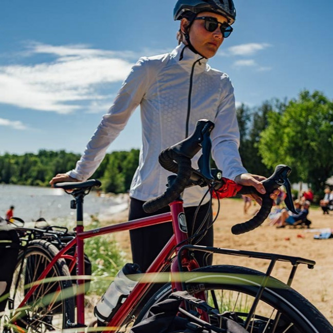 woman standing next to bike