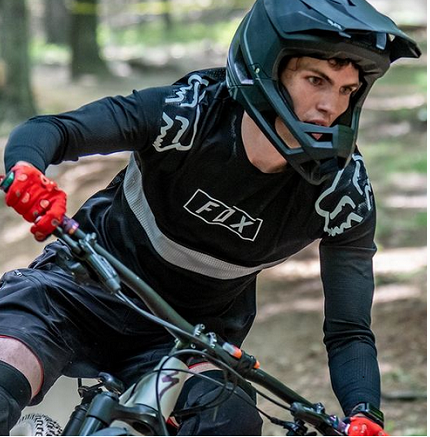 Man racing a mountain bike