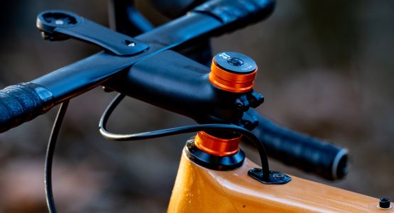 Close up of the rear brake cable as it is routed from the handlebars and into the top tube