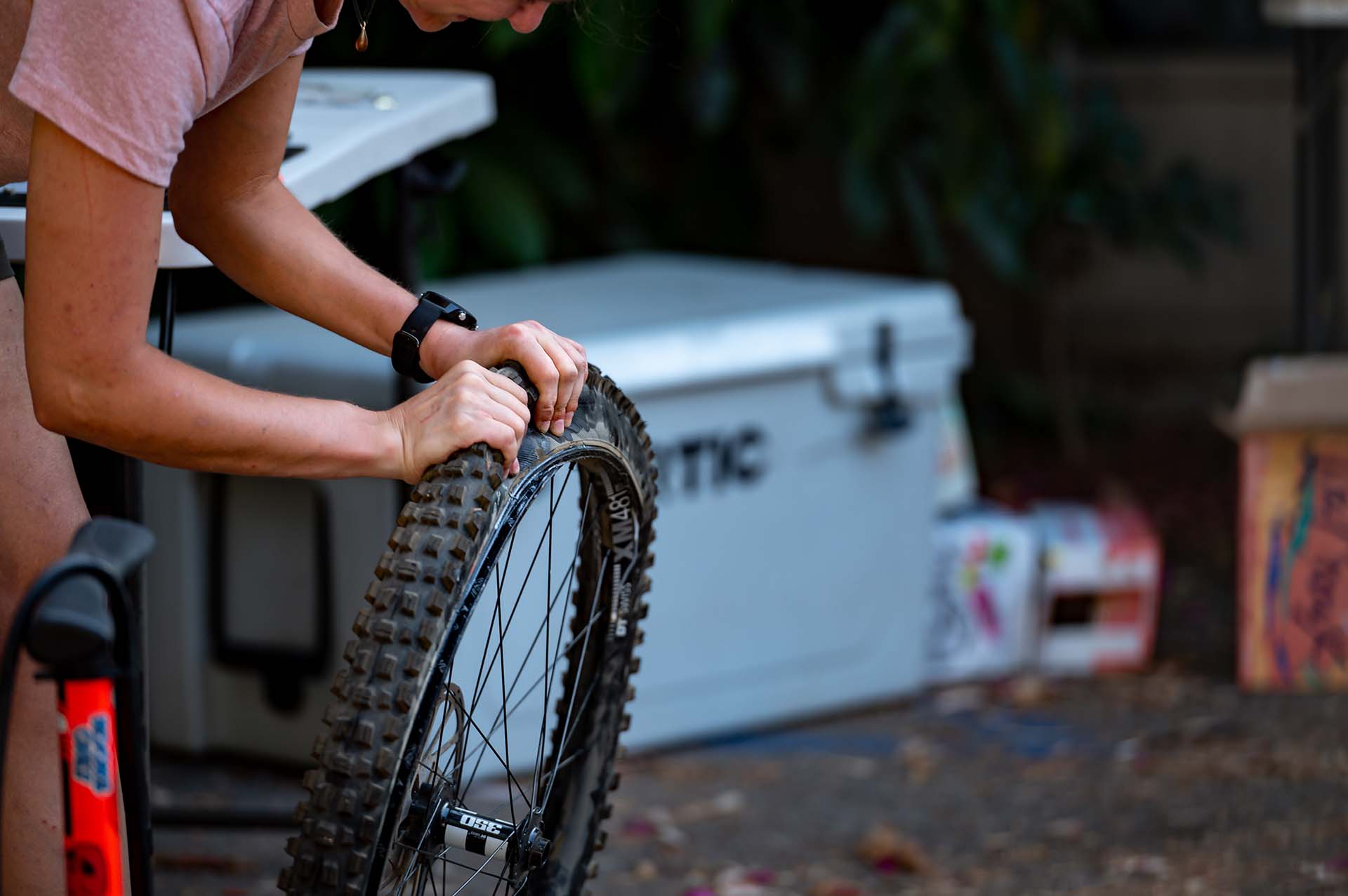 Bree Duffy demonstrates fixing a flat on a mountain bike