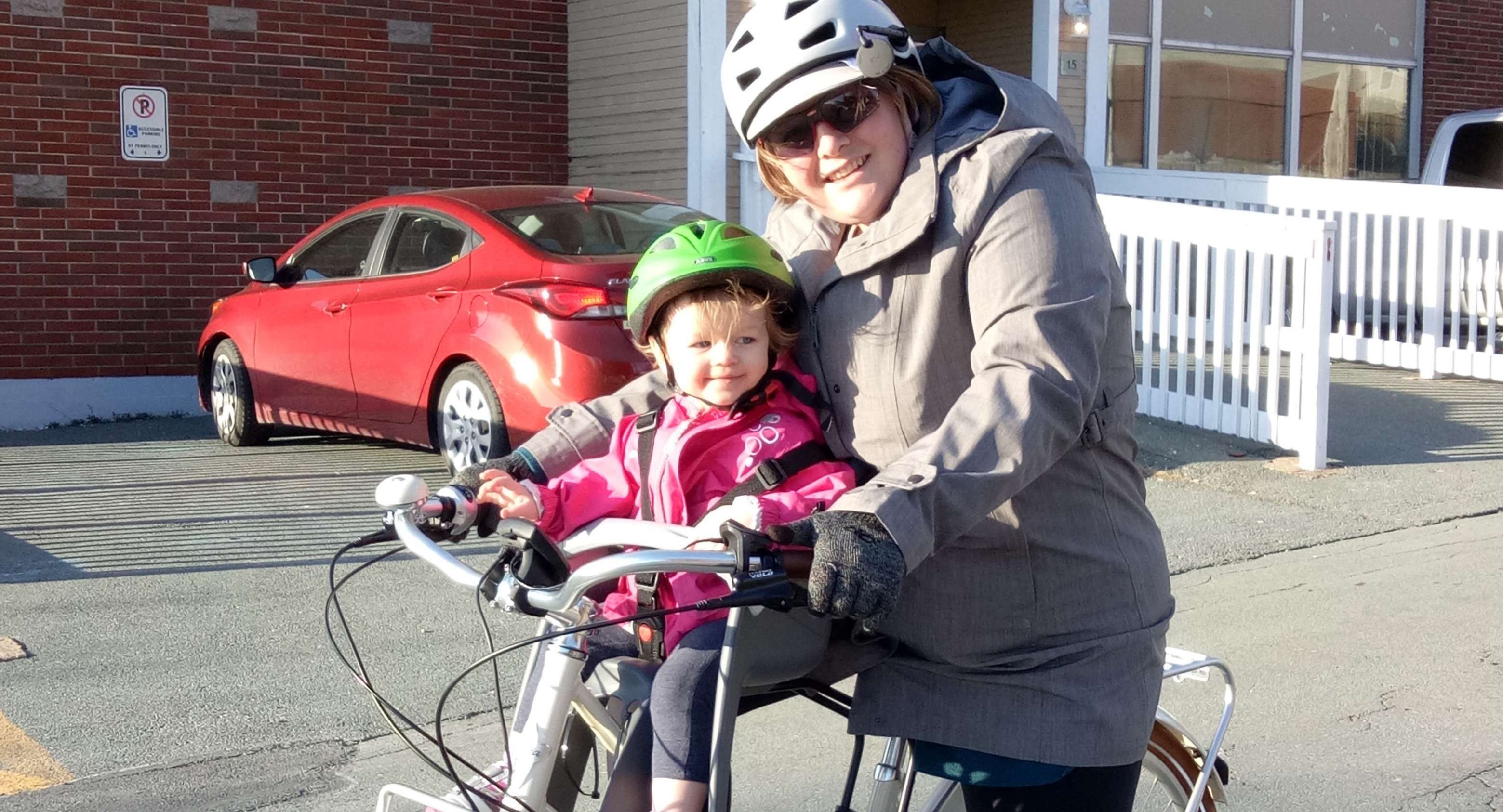 Jenna and her daughter on a bike