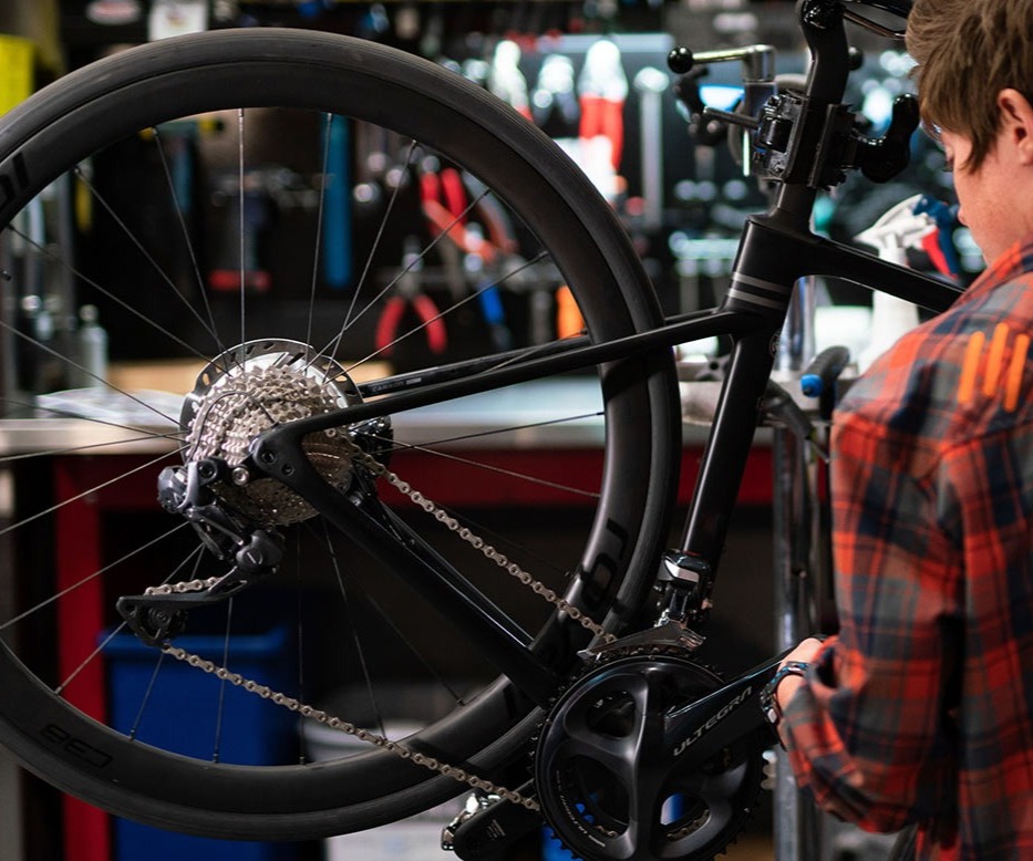 Bike Mechanic working on a bike image