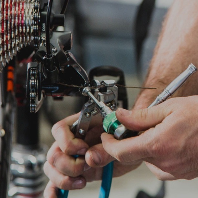 Bicycle Repair Technician working on a bike.