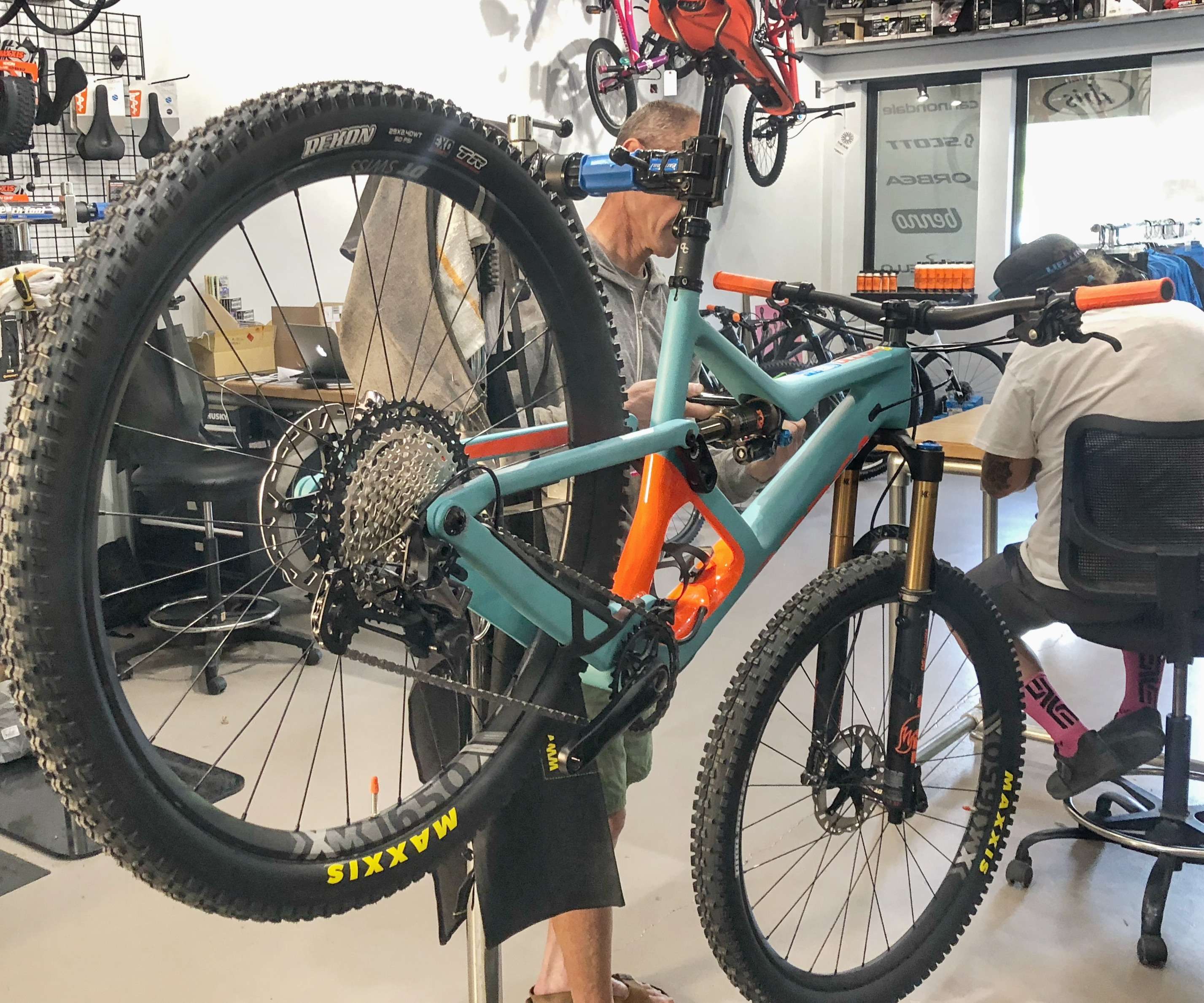 Bike mechanic fixing a mountain bike. 