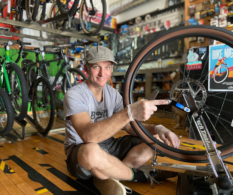 our mechanic working on a bike wheel