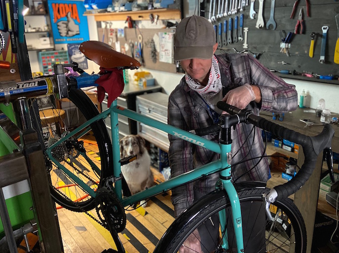 our mechanic wrenching on a Kona Sutra