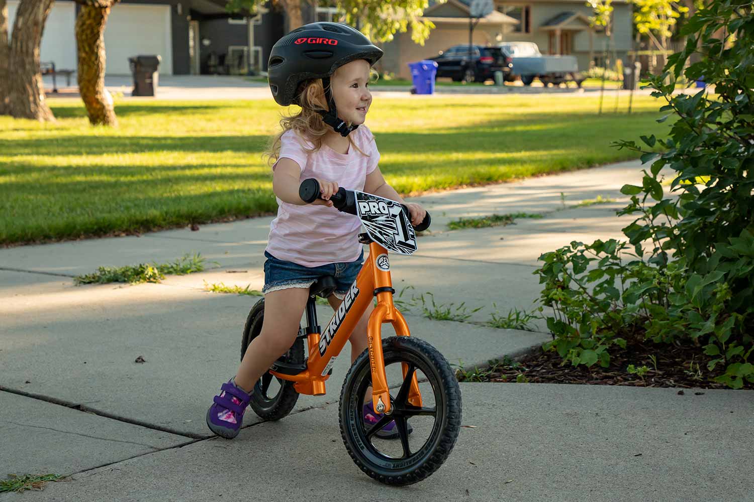 toddler riding 12" Strider Balance Bike