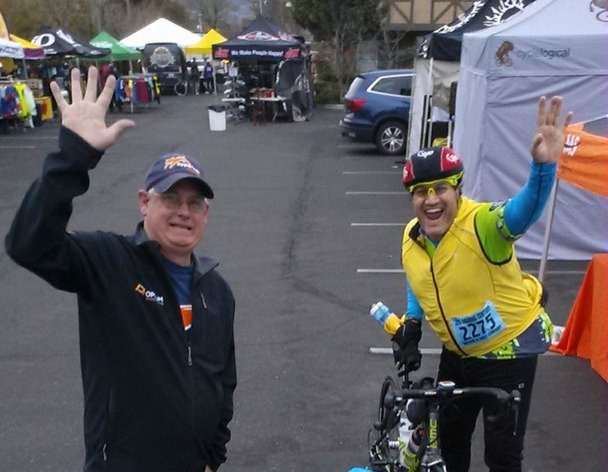 Philip Casanta and Jason Rocha wave in the Solvang Century Expo Area