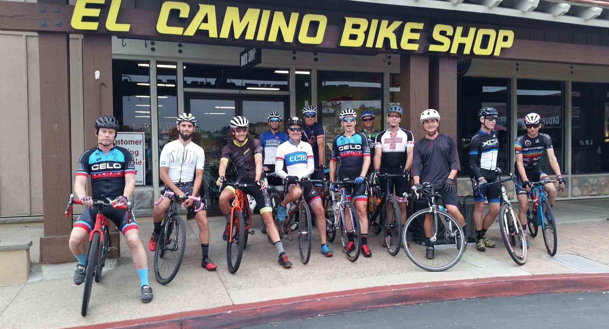 Group of cyclists in front of El Camino Bike Shop