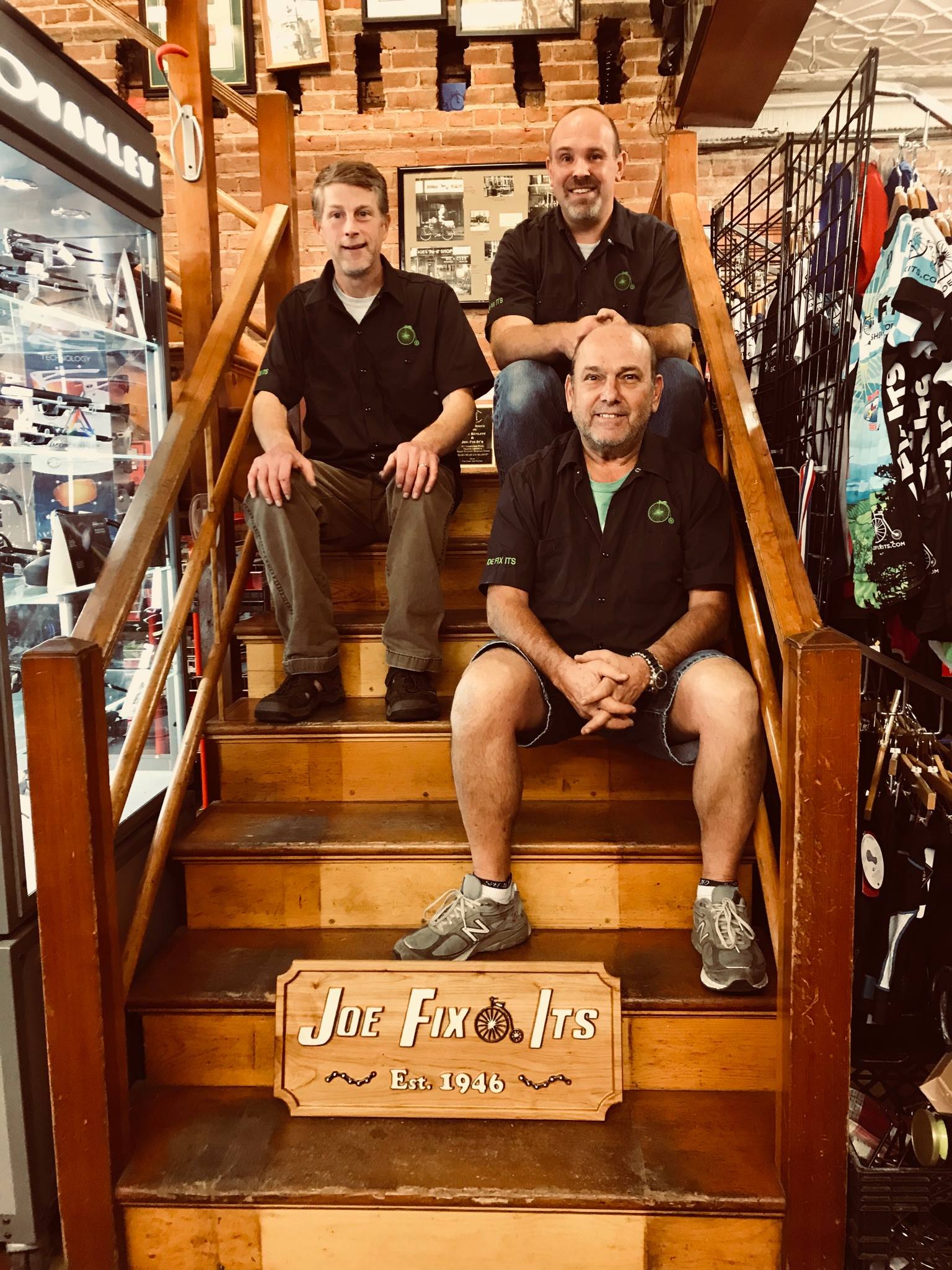 Joe Fix Its Employees on stairs