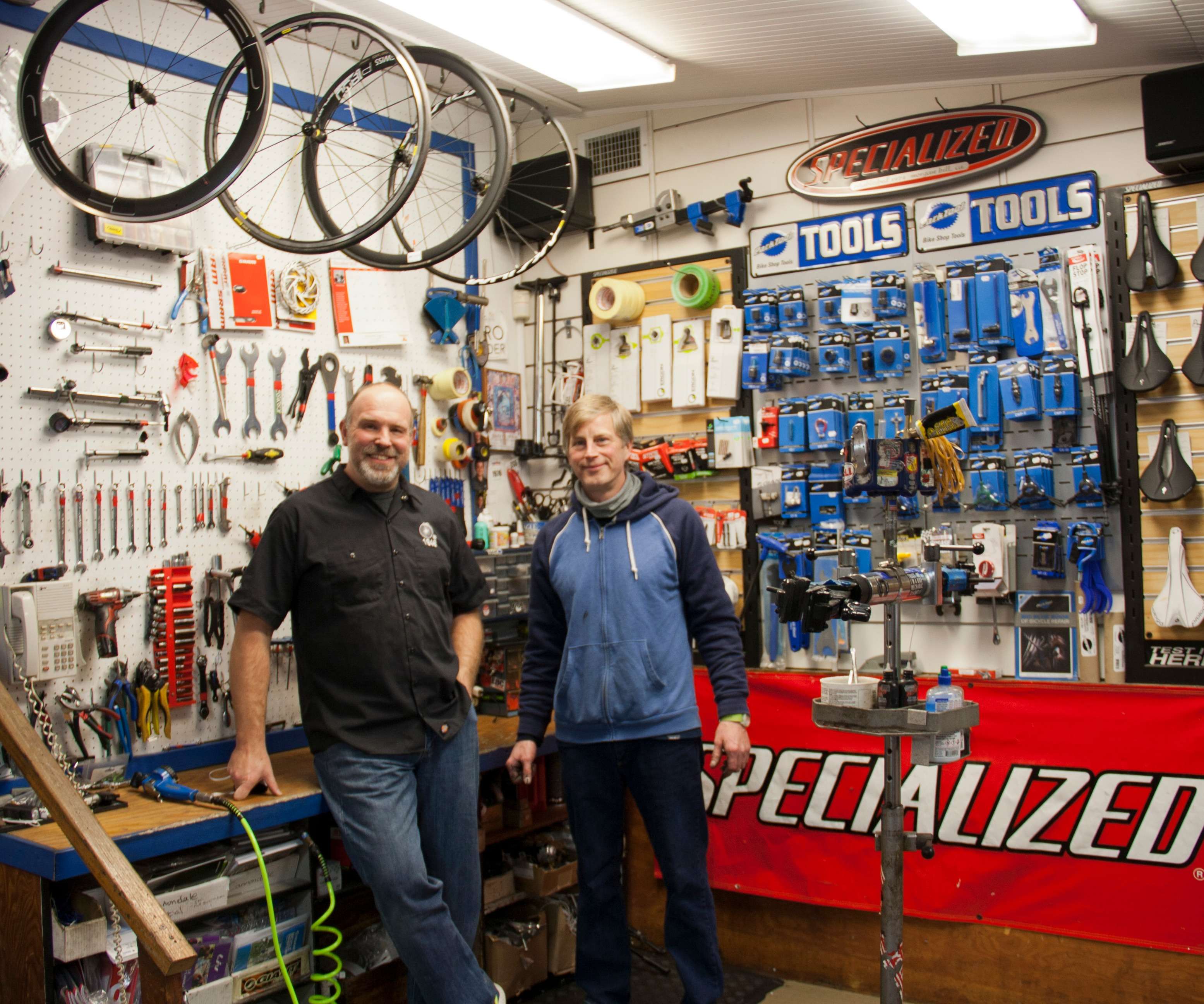 Person holding bicycle fit measurement tools