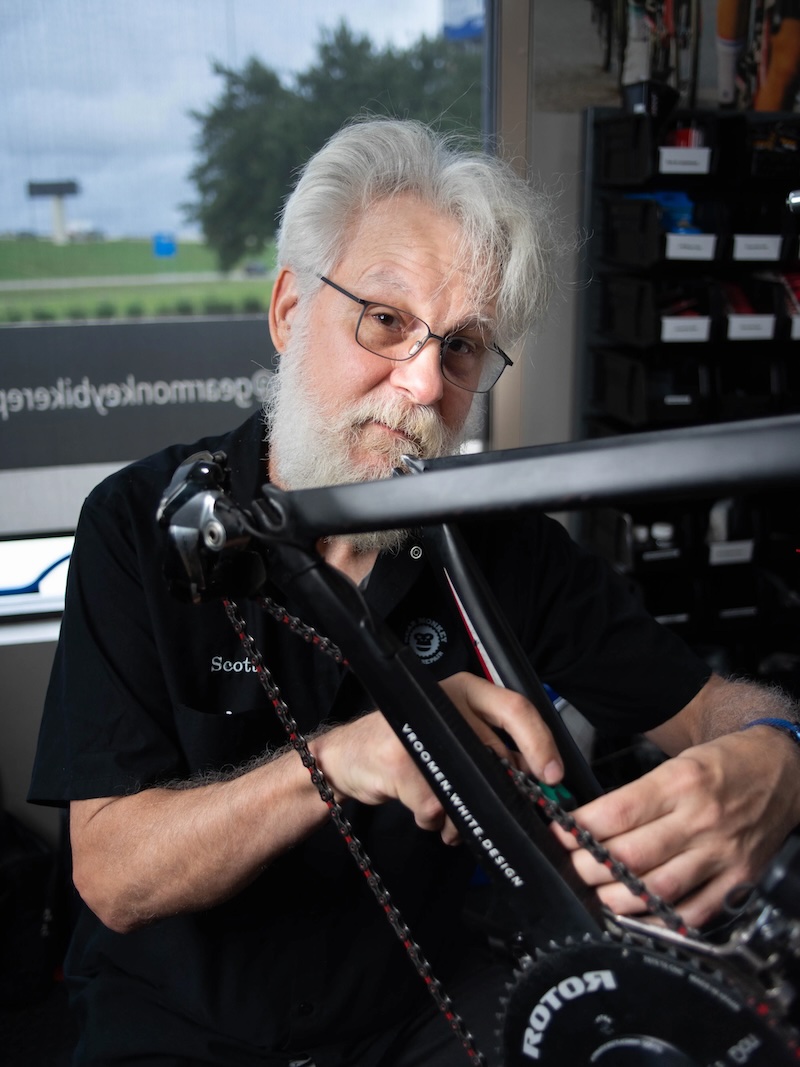 Scott Barnes, Mechanic working on a bicycle chain