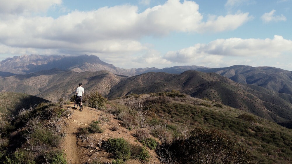 Cyclist enjoying a view of the mountains