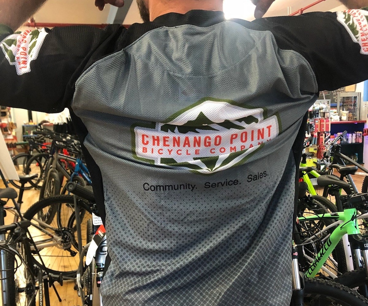 Person wearing Chenango Point Bicycle Company jersey