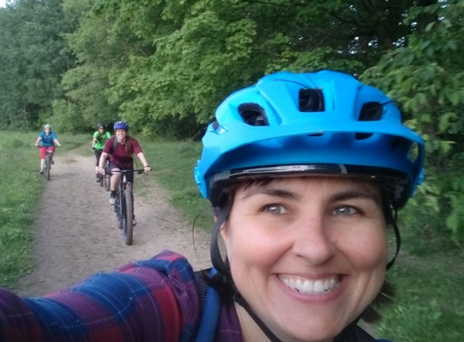 Mountain Bike Instructor leading a class on a ride