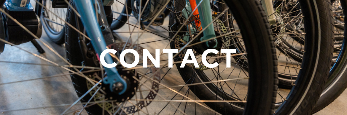 Bike wheels. Text: Contact