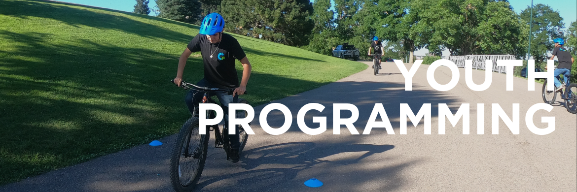 Male intern on bike. Text: Youth Programming