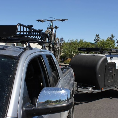 a truck with a roof and bike rack