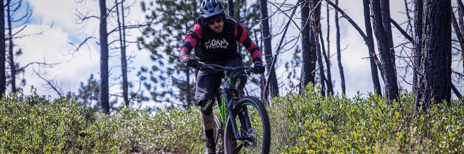 Mountain biker riding an eBike on the trails