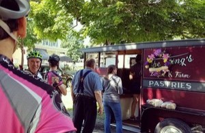 People in line at a food truck for pastries