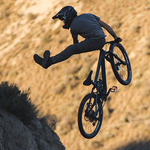 norco e-bike and rider high above ground