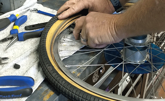 Removing bicycle tire from wheel