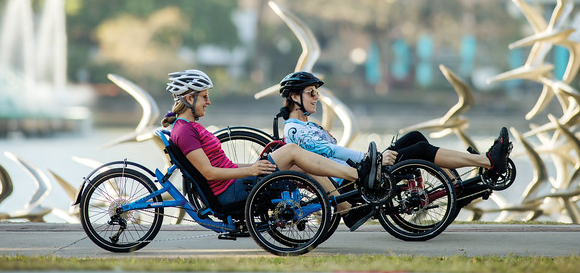 two female riders on recumbent bicycles