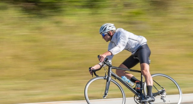 cyclist on a road bike with a blurred background
