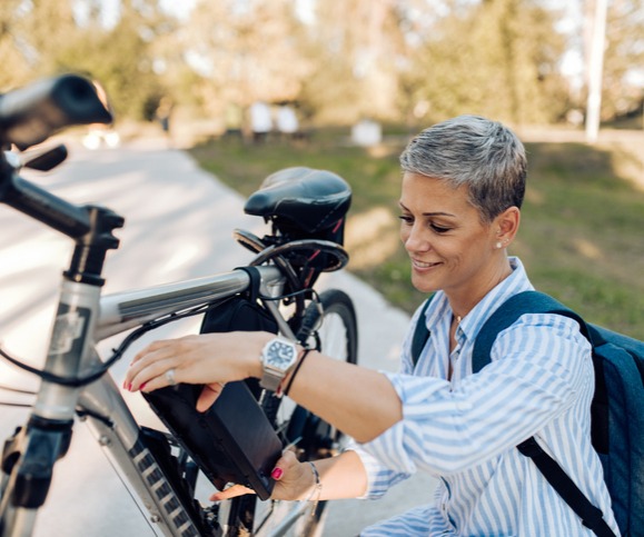 Woman removing her e-battery for charging