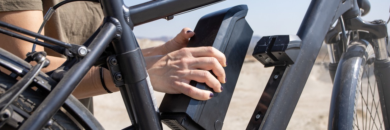 Cyclist removing her e-battery for charging