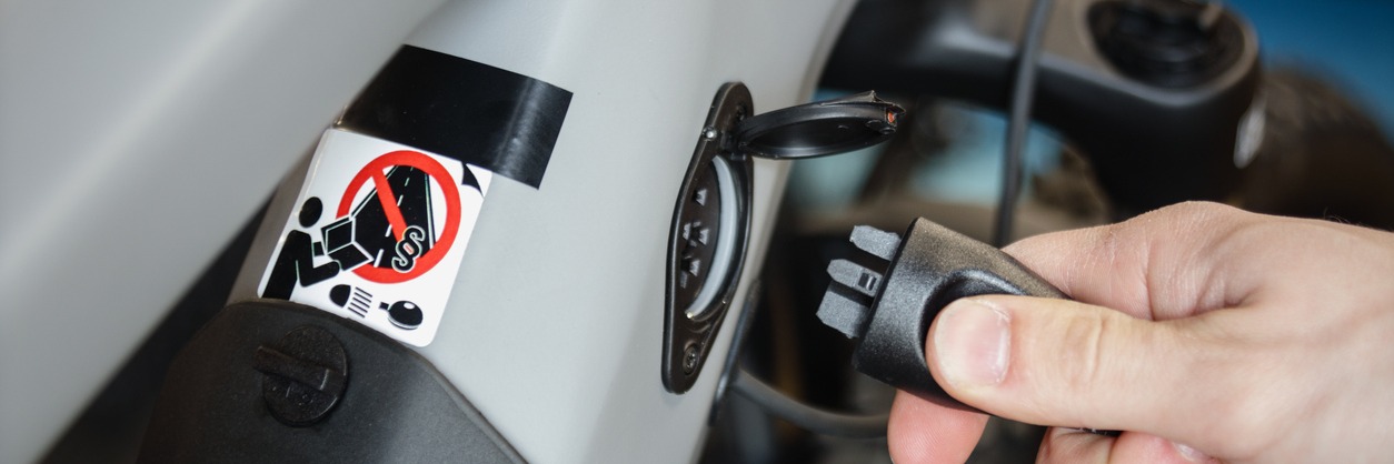 Cyclist plugging into his bike's e-battery