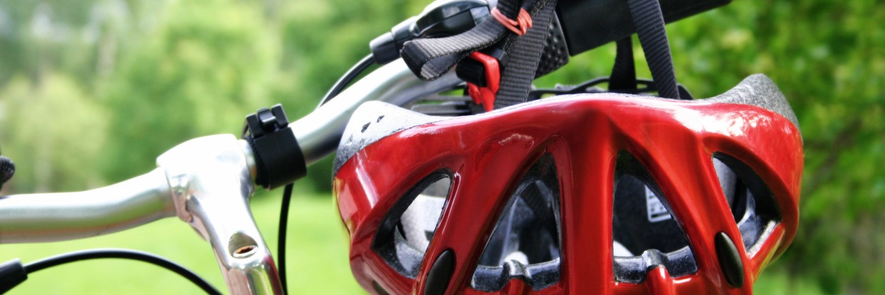 Silhouette of a mountain bike rider at sundown with mountains