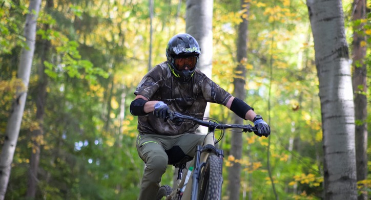 Mountain bike rider leaning into a sharp turn