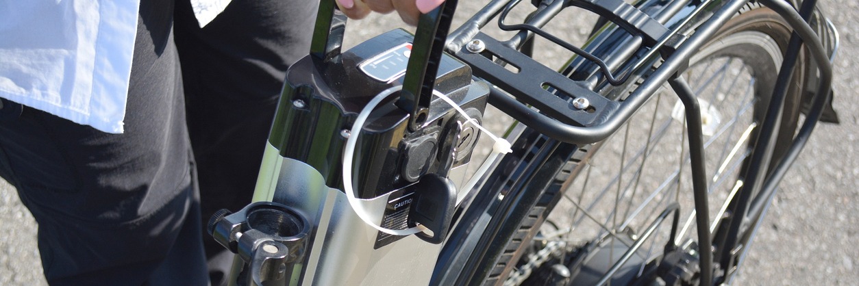 Cyclist removing his e-battery for charging